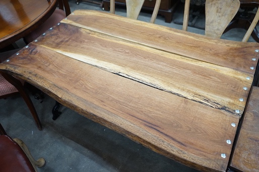 A Victorian style cast metal garden table with waney edged oak plank top, length 122cm, depth 76cm, height 68cm